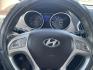 2013 Bronze /Black Hyundai Tucson Limited 2WD (KM8JU3AC9DU) with an 2.4L L4 DOHC 16V engine, 6-Speed Automatic transmission, located at 2425 Franklin Ave., Waco, TX, 76701, (254) 753-6661, 31.540359, -97.148682 - Very nice Hyundai Tucson Limited, cold AC, only 100K, Weather Tech floor mats, good tires, tint. See at Massey Motors, we can suggest a lender if you need financing. Priced below book value, out the door price includes TTL AND FEES. $8628.49 total- Photo#4
