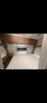 2004 WHITE Weekend Warrior Trailers Inc WEEKEND WARRIOR TOY HAULER - (5HRFF26204C) , located at 2425 Franklin Ave., Waco, TX, 76701, (254) 753-6661, 31.540359, -97.148682 - 2004 WEEKEND WARRIOR 2600 FS TOY HAULER equiped with Fuel Station, Onan 5500 Generator, cold A/C, Huge Basement Storage, 4 Beds sleeps 6 or more, Microwave, cold 8 Cubic Ft. Refrigerator, Oven and Stove Top, Solar Panel, Well taken care of and ready for your fun vacation or camping trip. Bumper P- Photo#5