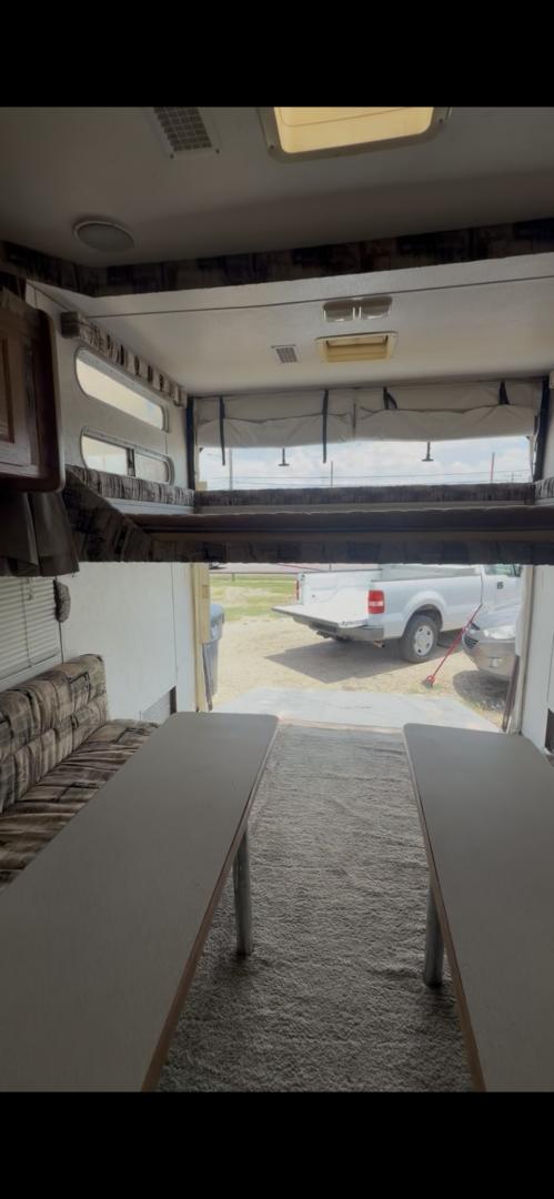 2004 WHITE Weekend Warrior Trailers Inc WEEKEND WARRIOR TOY HAULER - (5HRFF26204C) , located at 2425 Franklin Ave., Waco, TX, 76701, (254) 753-6661, 31.540359, -97.148682 - 2004 WEEKEND WARRIOR 2600 FS TOY HAULER equiped with Fuel Station, Onan 5500 Generator, cold A/C, Huge Basement Storage, 4 Beds sleeps 6 or more, Microwave, cold 8 Cubic Ft. Refrigerator, Oven and Stove Top, Solar Panel, Well taken care of and ready for your fun vacation or camping trip. Bumper P- Photo#3