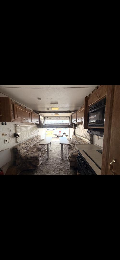 2004 WHITE Weekend Warrior Trailers Inc WEEKEND WARRIOR TOY HAULER - (5HRFF26204C) , located at 2425 Franklin Ave., Waco, TX, 76701, (254) 753-6661, 31.540359, -97.148682 - 2004 WEEKEND WARRIOR 2600 FS TOY HAULER equiped with Fuel Station, Onan 5500 Generator, cold A/C, Huge Basement Storage, 4 Beds sleeps 6 or more, Microwave, cold 8 Cubic Ft. Refrigerator, Oven and Stove Top, Solar Panel, Well taken care of and ready for your fun vacation or camping trip. Bumper P- Photo#8