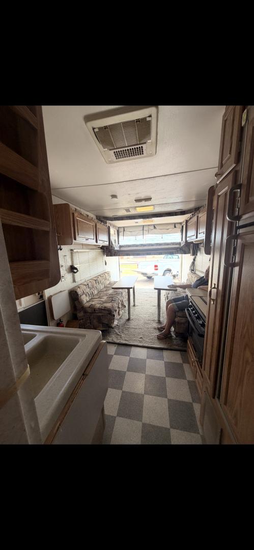 2004 WHITE Weekend Warrior Trailers Inc WEEKEND WARRIOR TOY HAULER - (5HRFF26204C) , located at 2425 Franklin Ave., Waco, TX, 76701, (254) 753-6661, 31.540359, -97.148682 - 2004 WEEKEND WARRIOR 2600 FS TOY HAULER equiped with Fuel Station, Onan 5500 Generator, cold A/C, Huge Basement Storage, 4 Beds sleeps 6 or more, Microwave, cold 8 Cubic Ft. Refrigerator, Oven and Stove Top, Solar Panel, Well taken care of and ready for your fun vacation or camping trip. Bumper P- Photo#10