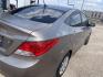 2014 Gold /Tan Hyundai Accent GLS 4-Door (KMHCT4AEXEU) with an 1.6L L4 DOHC 16V engine, Automatic transmission, located at 2425 Franklin Ave., Waco, TX, 76701, (254) 753-6661, 31.540359, -97.148682 - Gas Saver 27/38 mpg, drives great, cosmetic hail dmg, no ck engine lights, cold a/c, reg oil changes, highway ready. See at Massey Motors, 2425 Franklin, Waco. Call 254-753-6661 for test drive appointment.- Photo#5